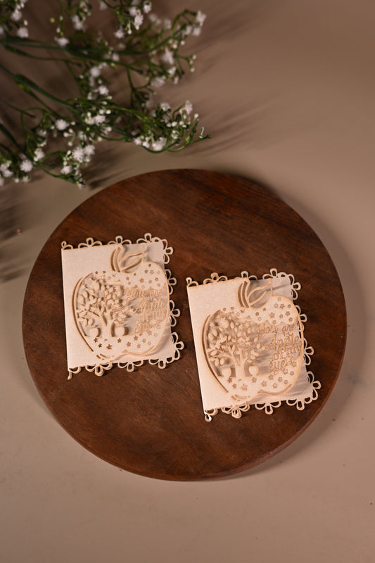 gift tag with laser cut apple design with tree inside it