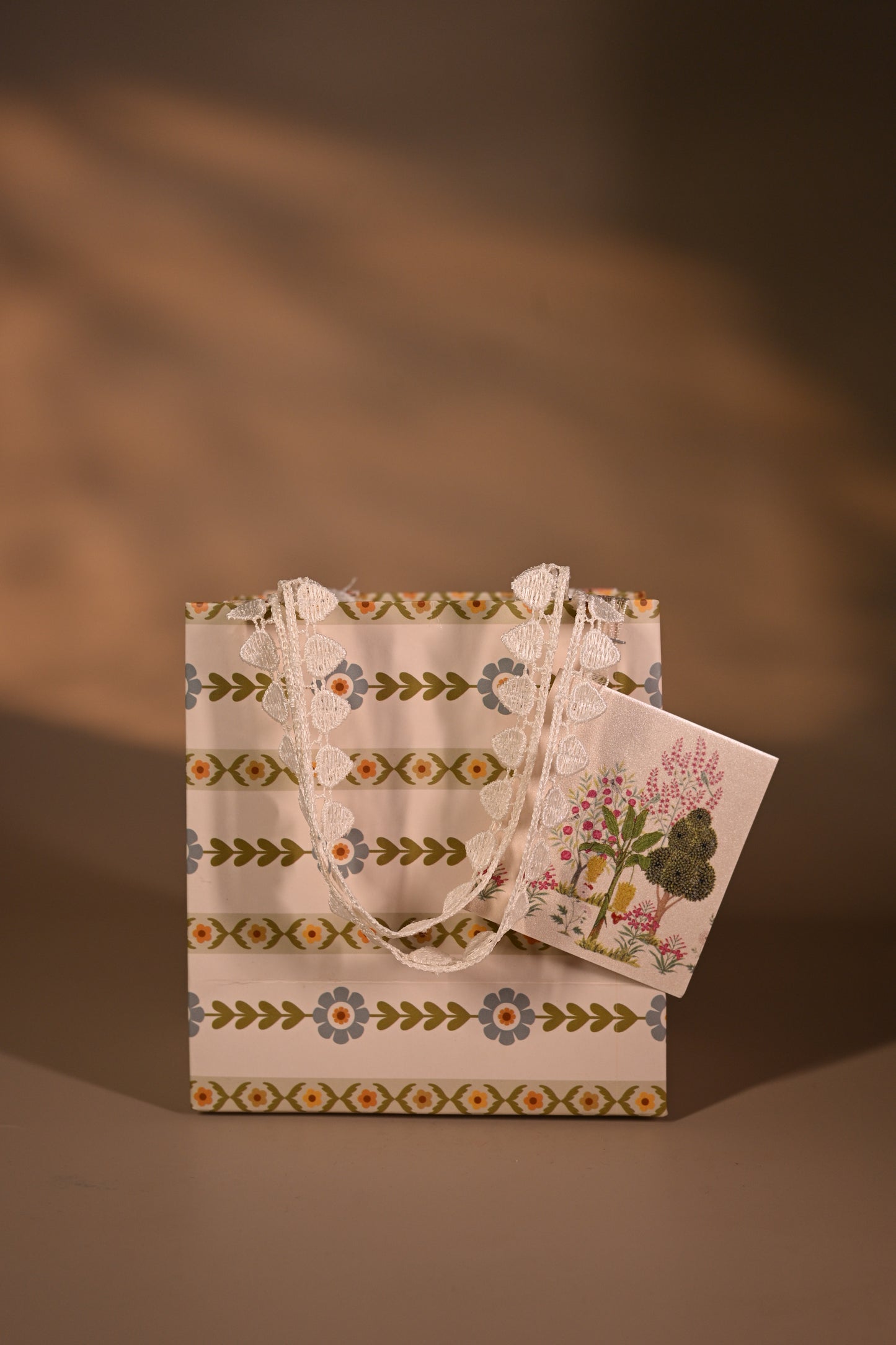 Packaged product with decorative tags on a striped background