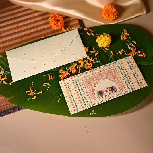 This mint green envelope has floral motifs and two elephants in the centre