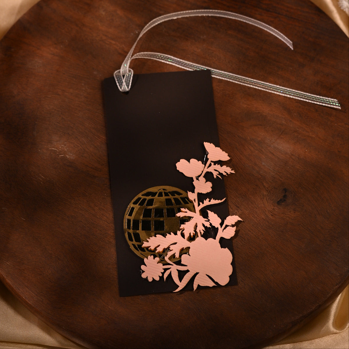 brown gift tags with laser-cut detailing, featuring floral designs and an acrylic disco ball