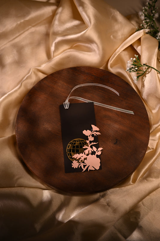 brown gift tags with laser-cut detailing, featuring floral designs and an acrylic disco ball