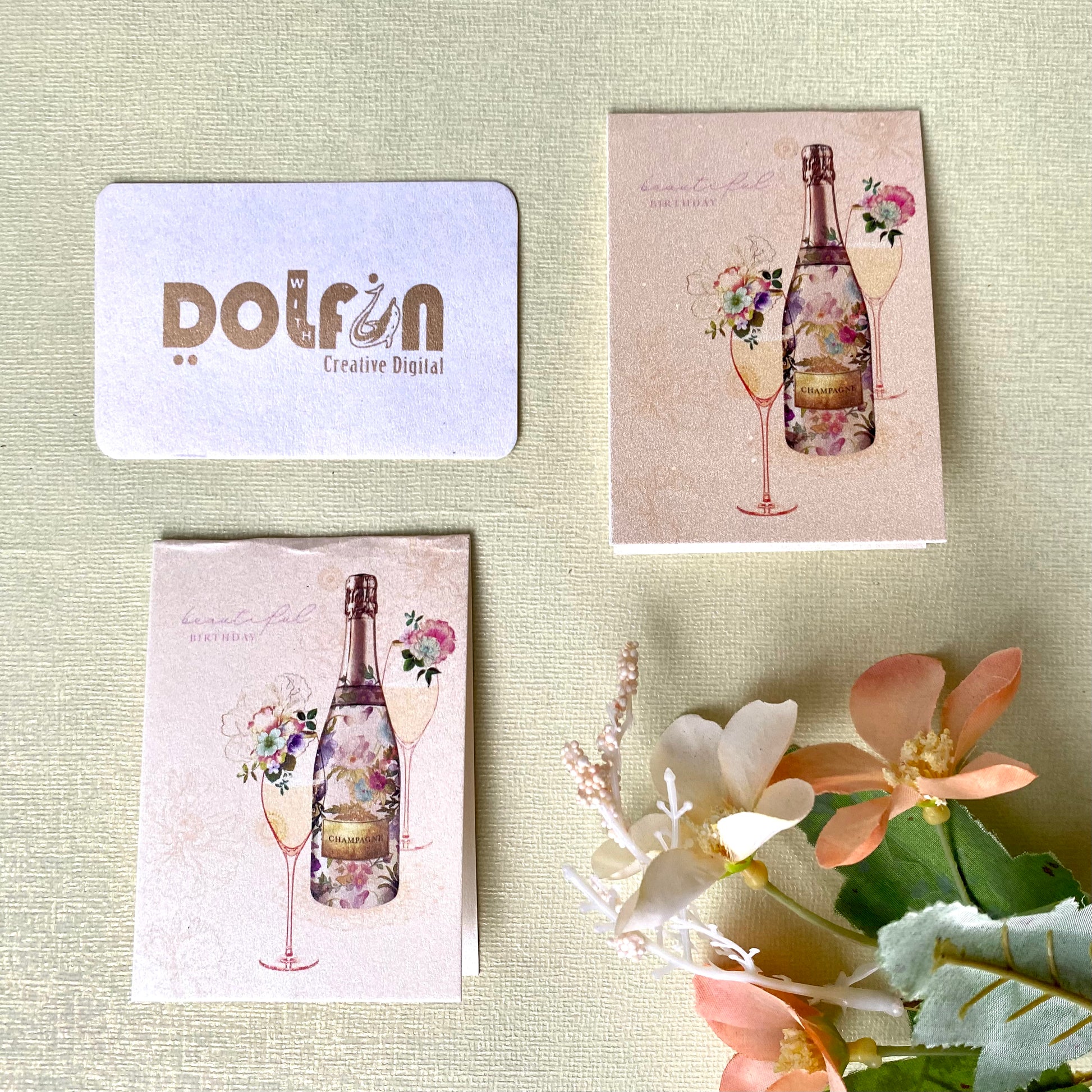 A set of metallic pink printed gift tags with a champagne theme