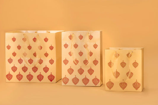 Three decorative Gift bag, paper bag with a red pattern on a beige background