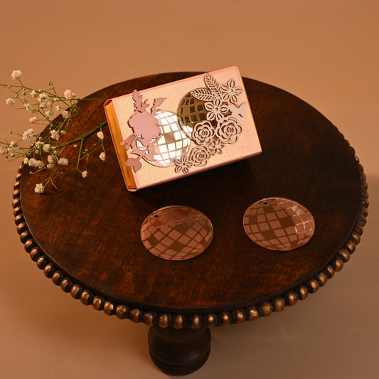 retro themed coin box with acrylic disco balls and floral detailing