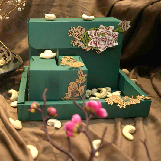 Green coloured dry fruit box set with laser-cut lotus and foliage embellishments