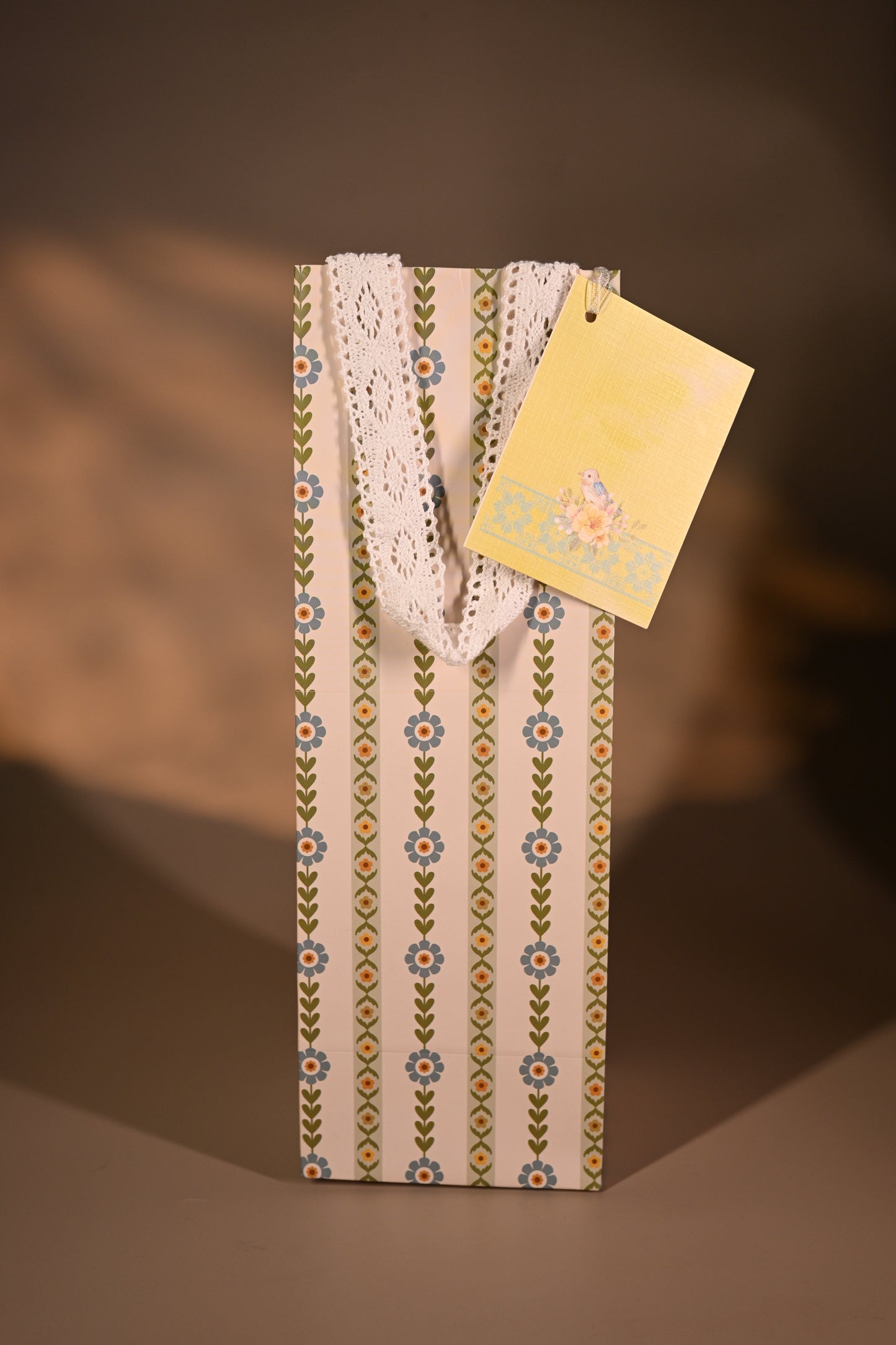 Packaged product with decorative tags on a striped background