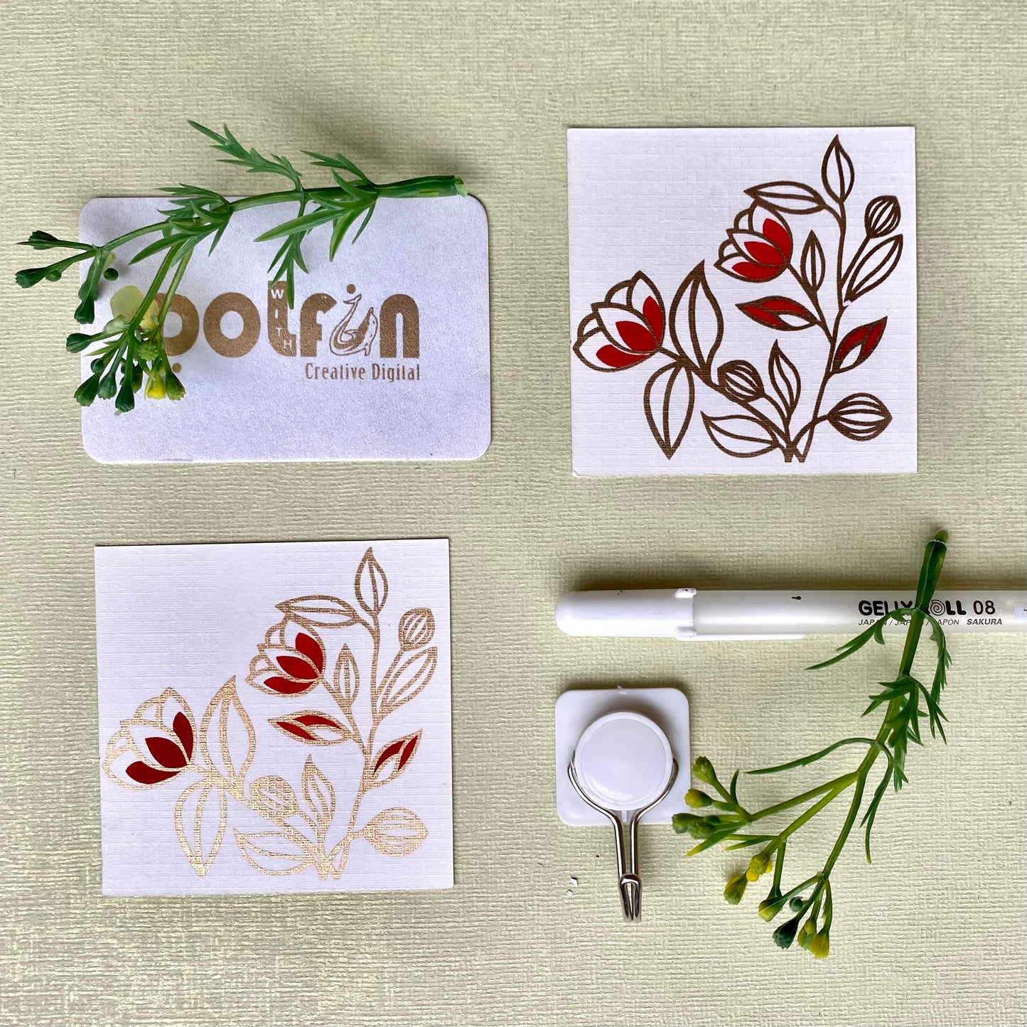 a set of red and gold printed gift tags with a floral design