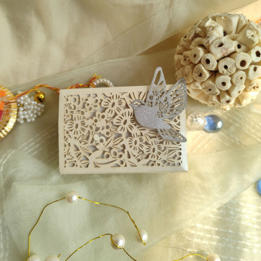 white colour full jali coin box with intricately laser-cut floral patterns and a bird