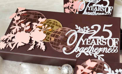 a brown coloured ift box with acrylic disco ball design and floral design
