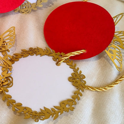 Layered blue gift tags with gold 'Best Wishes' text and gold bird cut-outs, in laser cut detailing