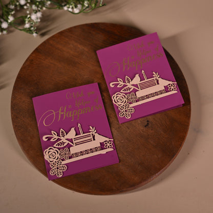 purple gift tags with intricate laser-cut detailing of birds, flowers and cake