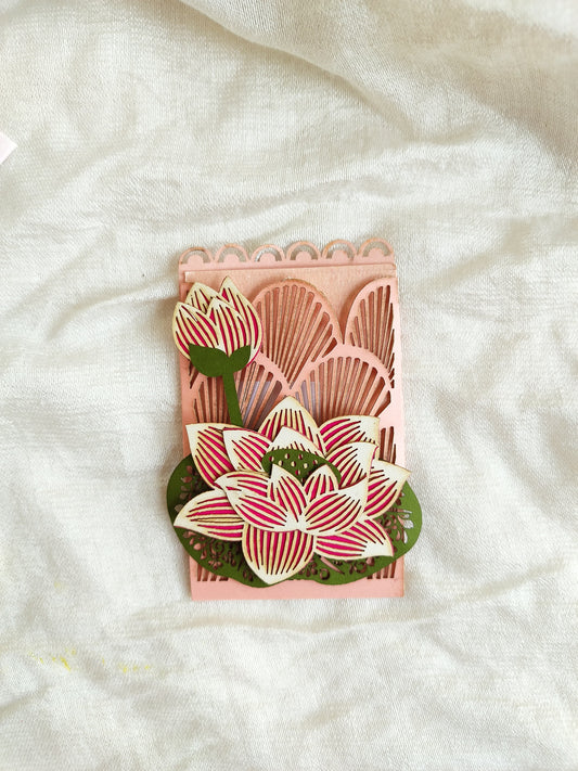 pink colour lotus coin pocket with laser-cut lotus and buds on it