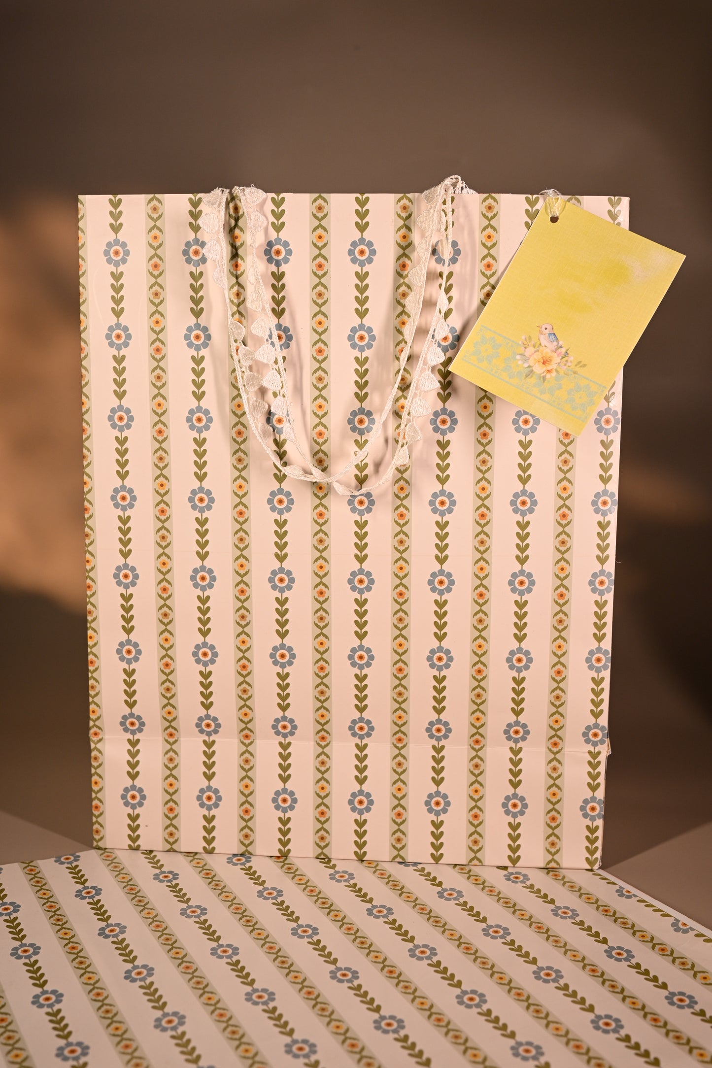 Packaged product with decorative tags on a striped background