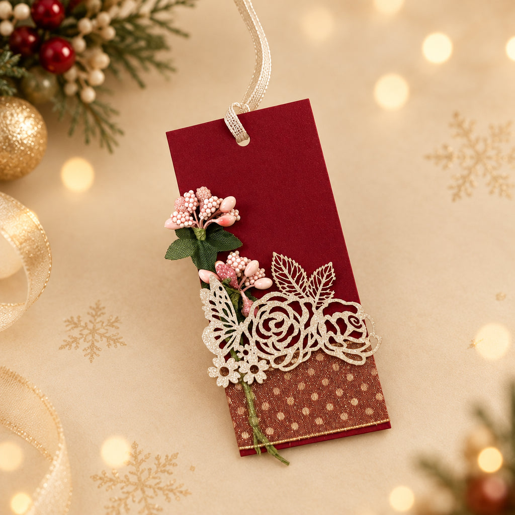 red gift tag with white ribbon and floral designs