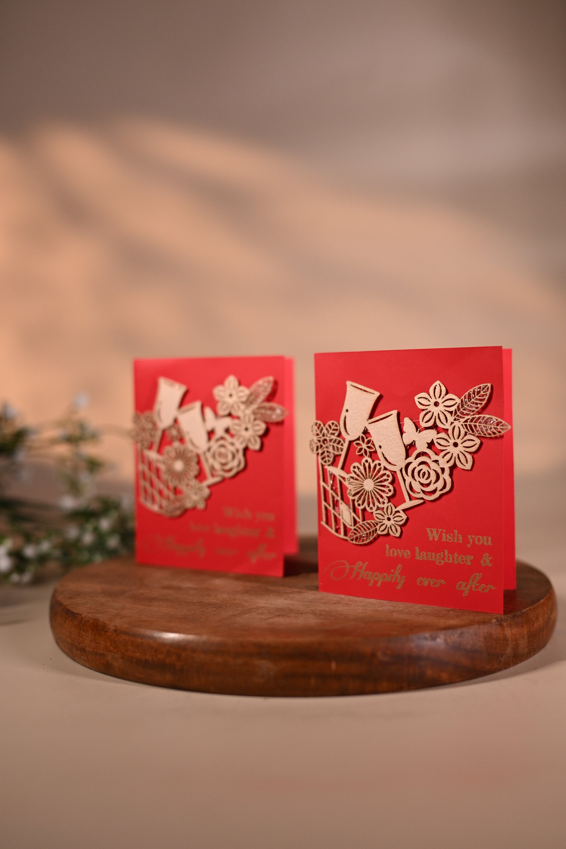 red gift tags with floral laser-cut patchwork and drinking glasses