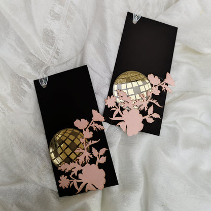 brown gift tags with laser-cut detailing, featuring floral designs and an acrylic disco ball