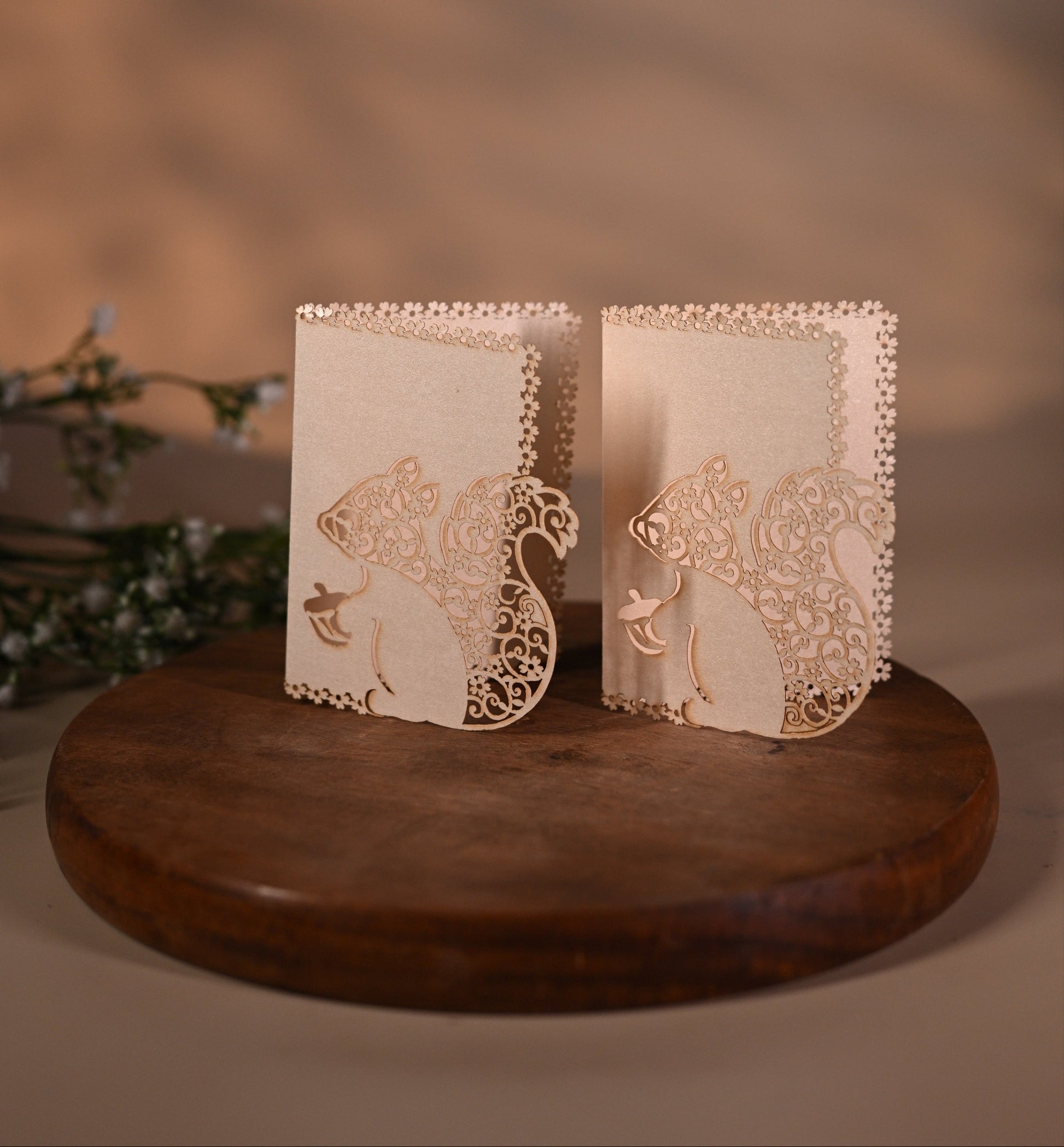 gift tag featuring laser cut squirrel design with intricate detailing inside it