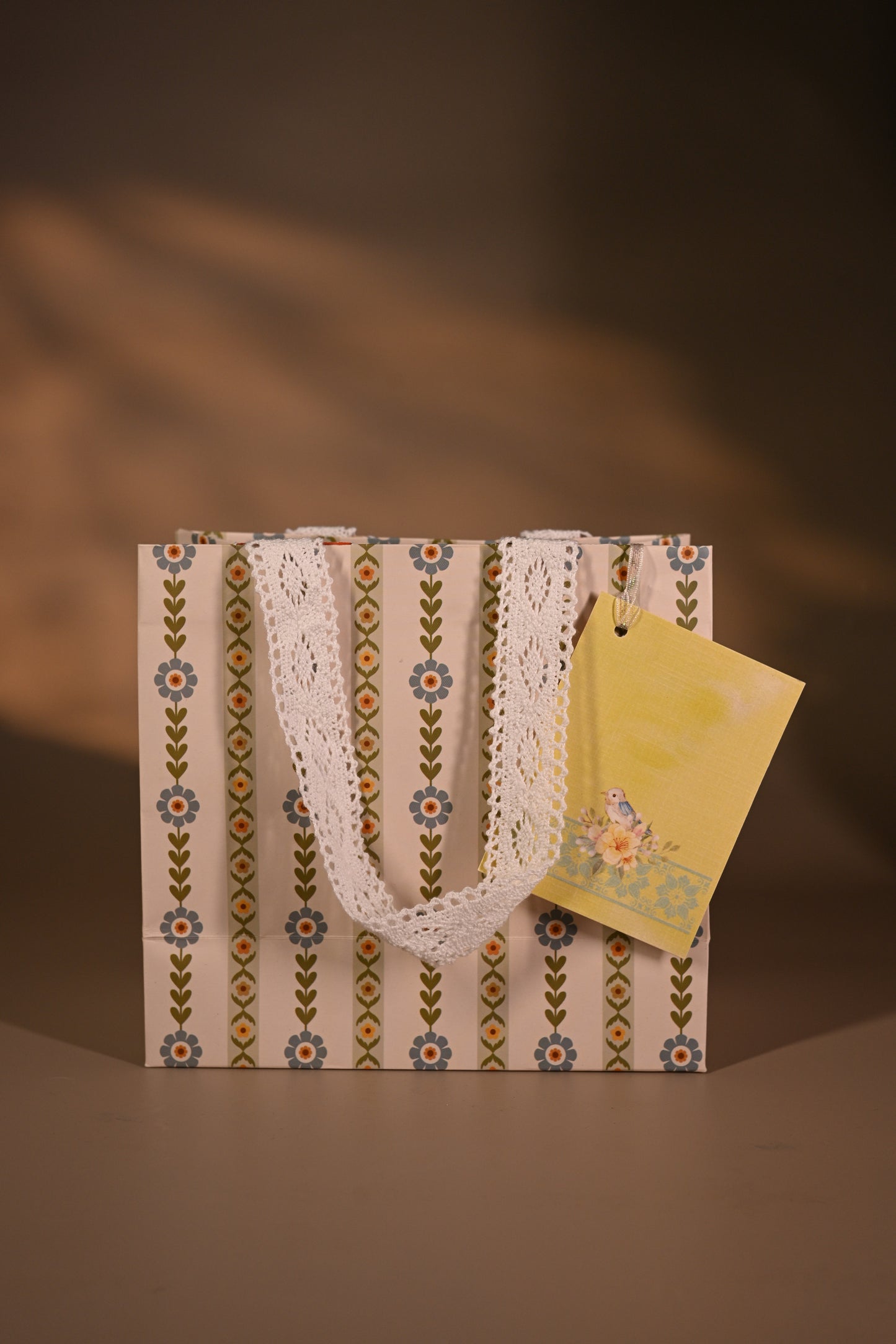 Packaged product with decorative tags on a striped background